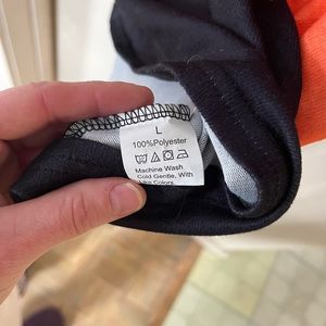 Black and Orange Polyester Garment